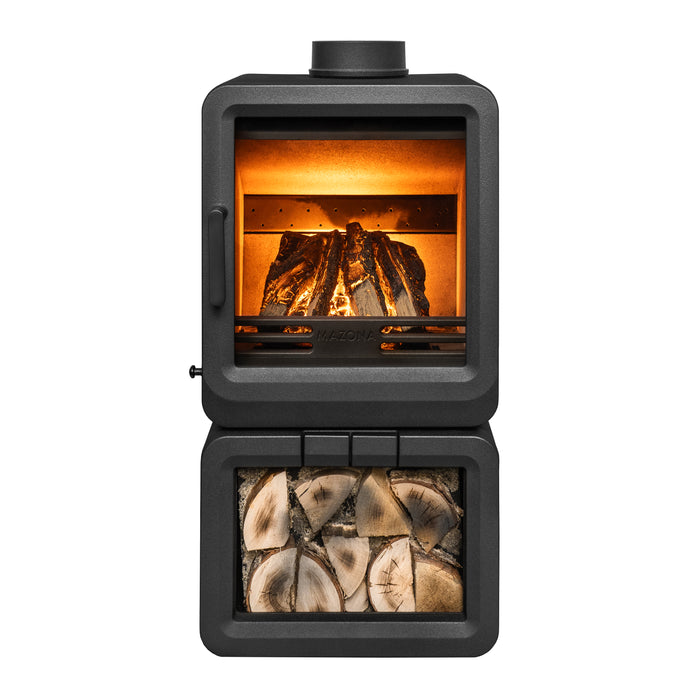 A black wood-burning stove with its door open, showing a glowing orange fire inside and a lower compartment filled with stacked logs, photographed on a plain white background.